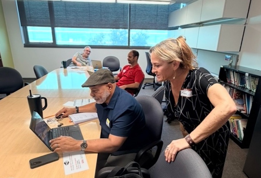 A facilitator helping out a SAILN Community of Practice participant.